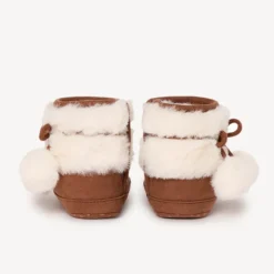 Bottines avec fausse fourrure et pompons pour bébé fille