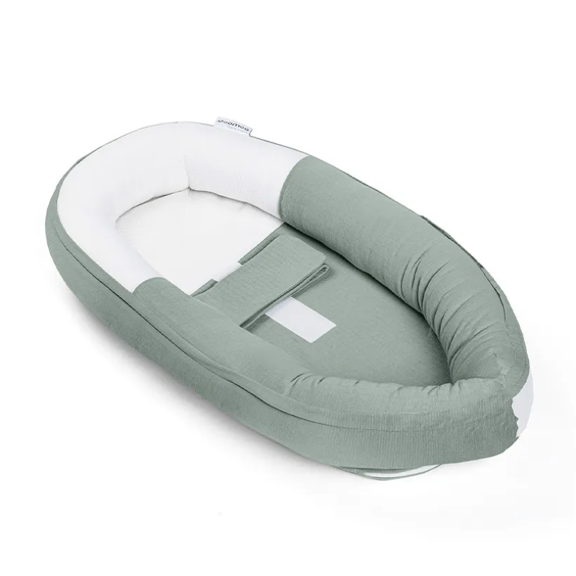 Cale-bébé et réducteur de lit ajustable Cocoon en tetra green