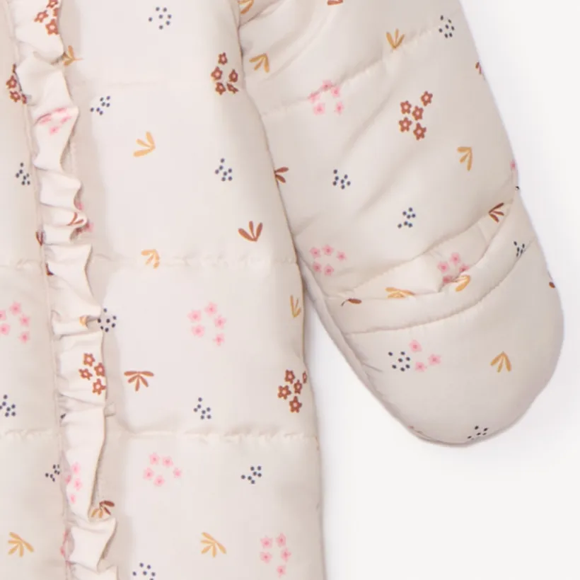 Combi-pilote imprimé fleurs pour bébé fille avec finitions différentes selon l'âge
