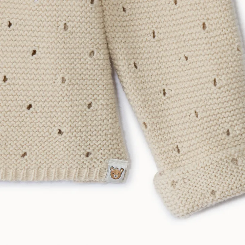 Gilet en tricot point mousse ajouré pour bébé