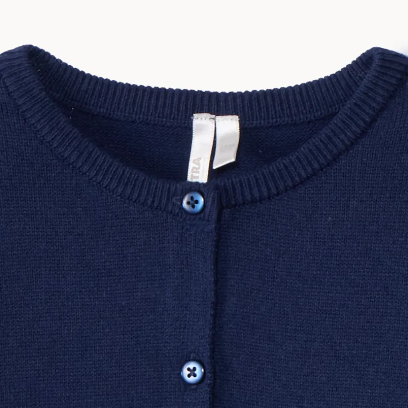 Gilet en tricot uni festonné pour bébé fille