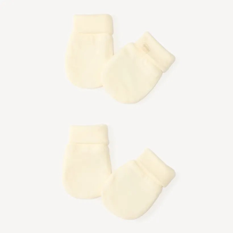Paire de moufles unies pour bébé